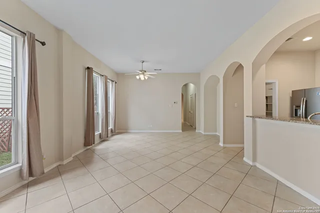 a view of a bathroom with a mirror and a shower