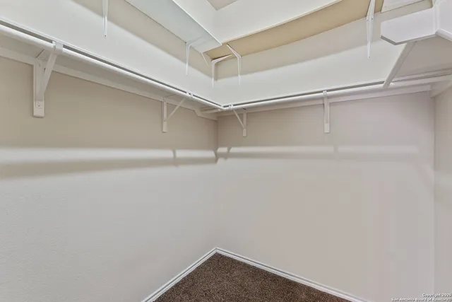 a view of an empty walk in closet