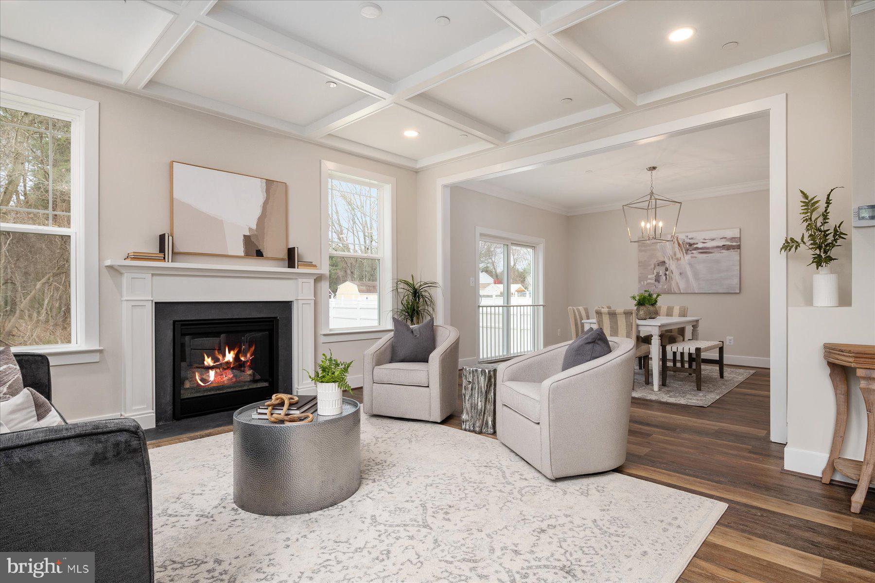 Family room with coffered ceilings and fireplace