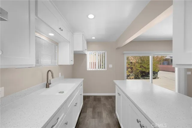 a stove top oven sitting inside of a kitchen