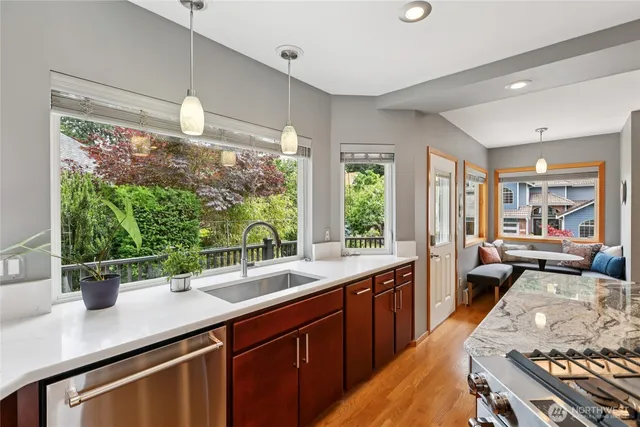 a kitchen with a large window and a sink