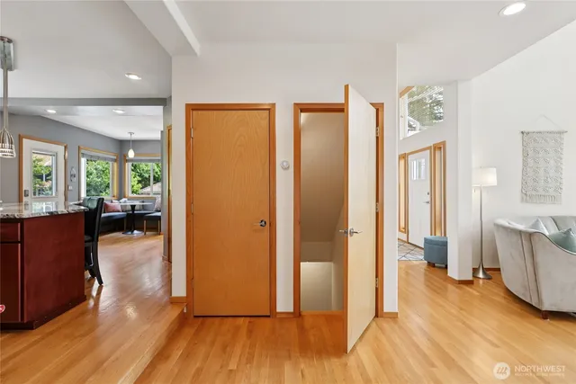 a view of a livingroom with hardwood floor and a large window
