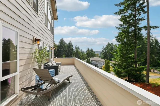 a view of a patio with couches and potted plants