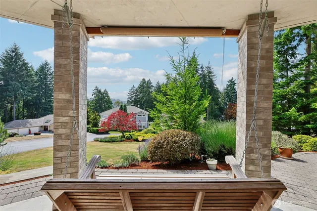 an aerial view of residential house with outdoor space and swimming pool
