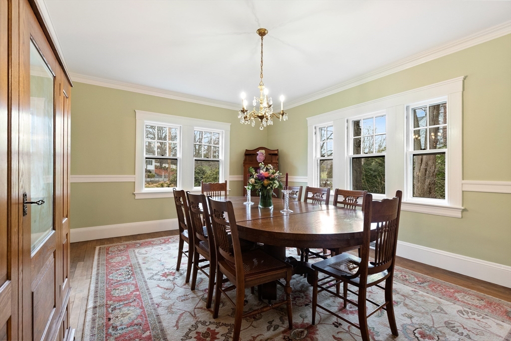 64 Marrett Road Lexington, MA 02421 - Photo 8 of 38 a dining room with furniture a chandelier and wooden floor
