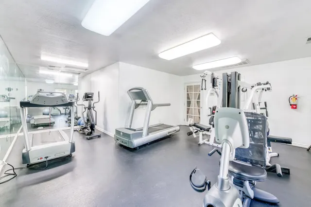 a view of a kitchen with a sink dishwasher stove and refrigerator
