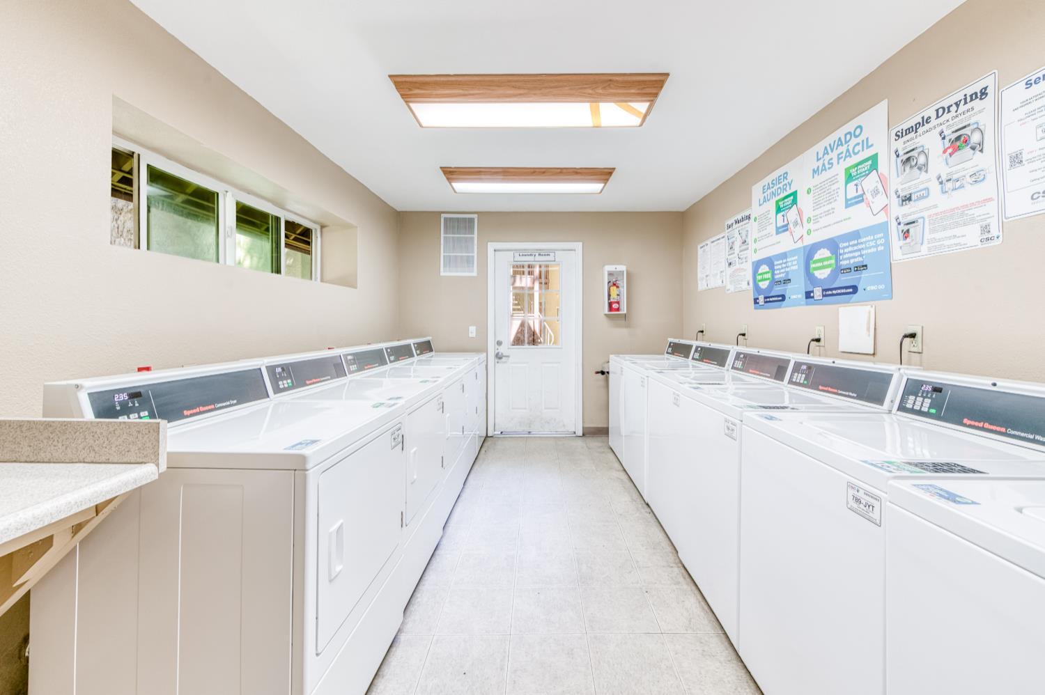 2909 Huntington Boulevard, Unit 145 Fresno, CA 93721 - Photo 27 of 33 a view of a kitchen with a sink dishwasher stove and refrigerator