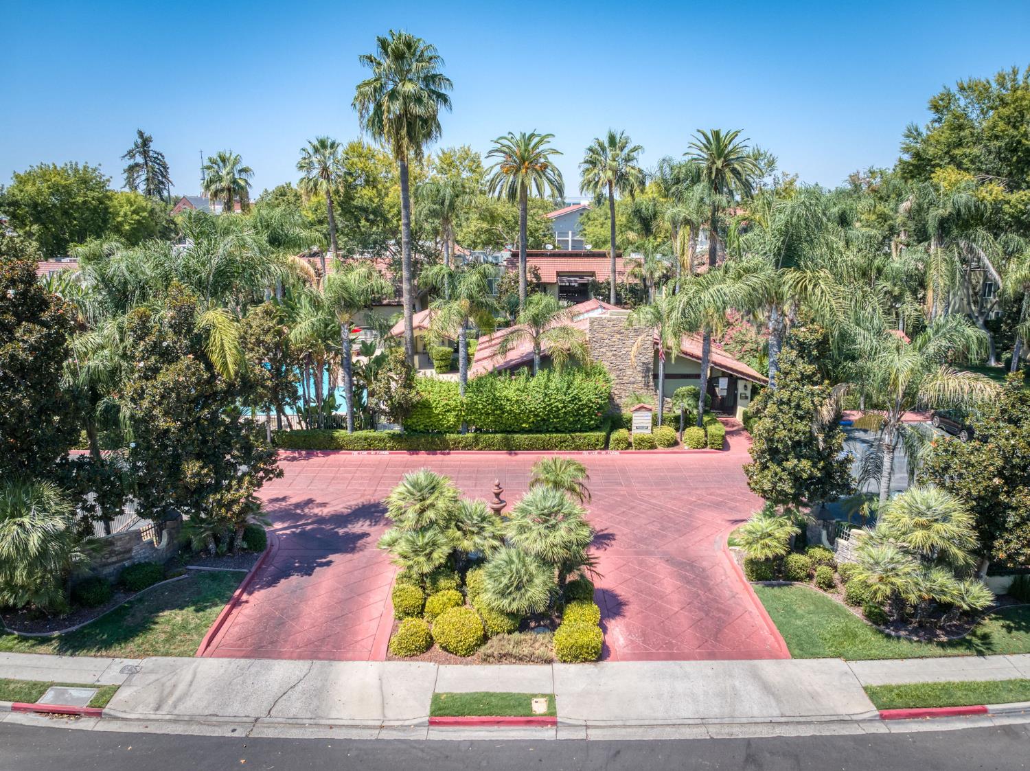 2909 Huntington Boulevard, Unit 145 Fresno, CA 93721 - Photo 29 of 33 a view of a yard with flower plants and wooden fence