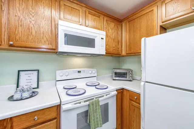 a kitchen with a stove and a microwave