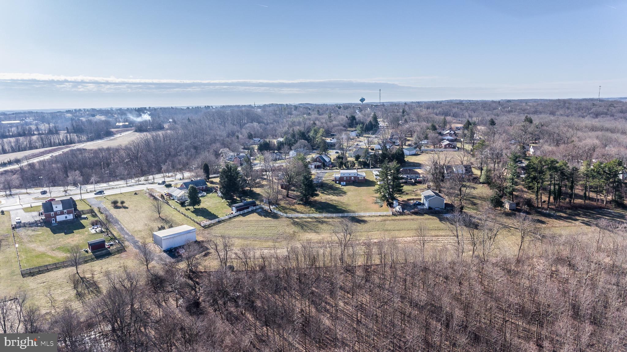 27008 Ridge Road Damascus, MD 20872 - Photo 12 of 14 an aerial view of a house with a yard and lake view