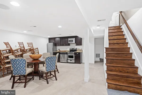 a kitchen with a stove and a refrigerator