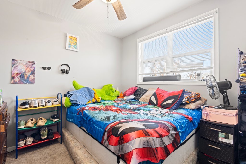 14564 Spaulding Avenue Harvey, IL 60426 - Photo 15 of 20 a bedroom with a bed and a window