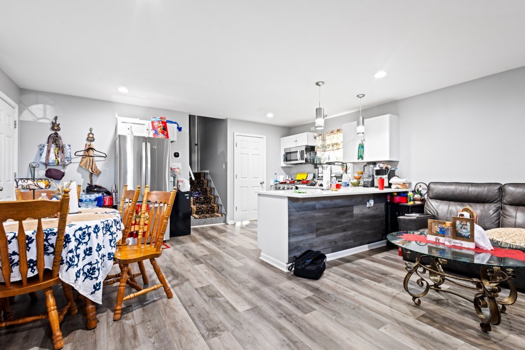 14564 Spaulding Avenue Harvey, IL 60426 - Photo 4 of 20 a living room filled with furniture and a wooden floor