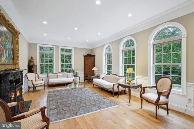 a living room with furniture rug and window