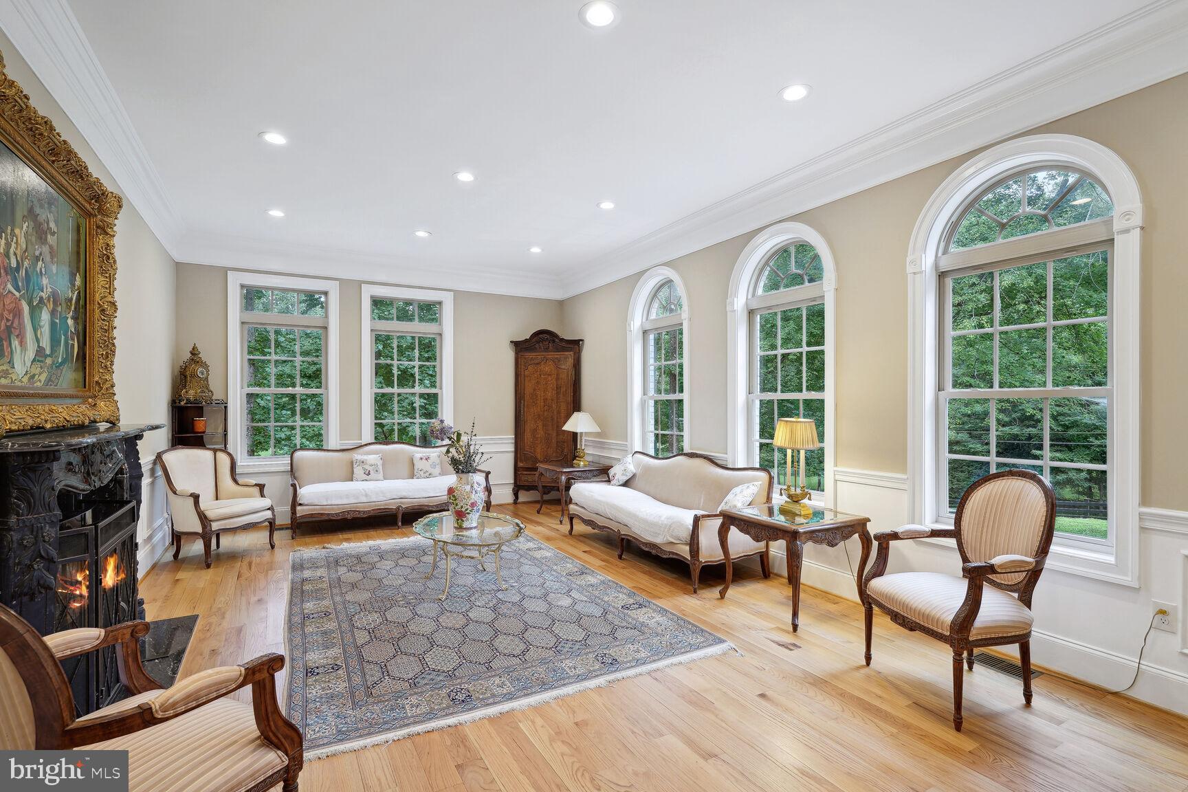 10813 Lockland Road Potomac, MD 20854 - Photo 13 of 73 a living room with furniture and a large window