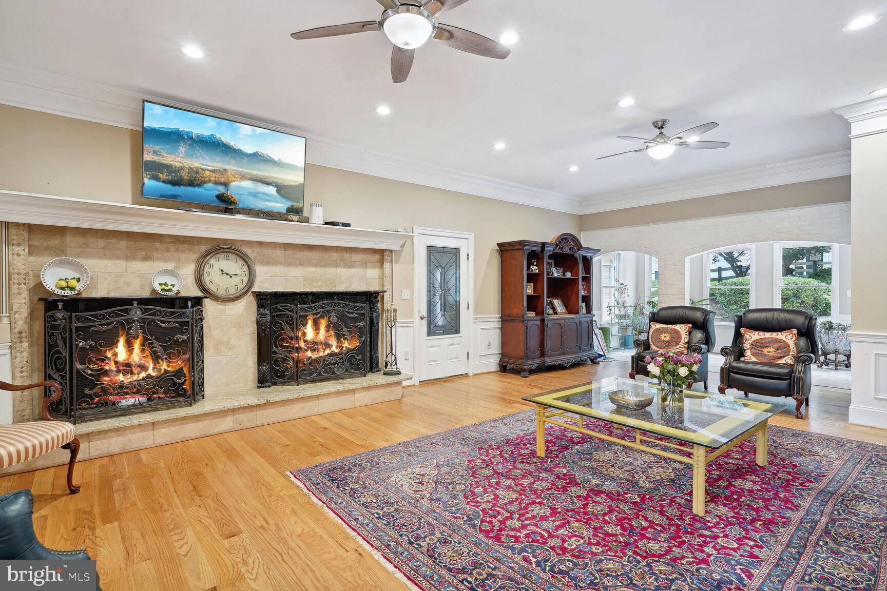 10813 Lockland Road Potomac, MD 20854 - Photo 17 of 73 a living room with furniture and a fireplace