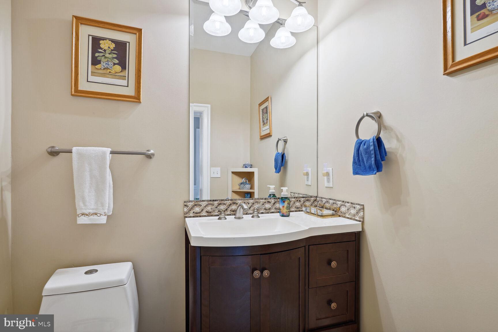 10813 Lockland Road Potomac, MD 20854 - Photo 19 of 73 a bathroom with a sink and a mirror