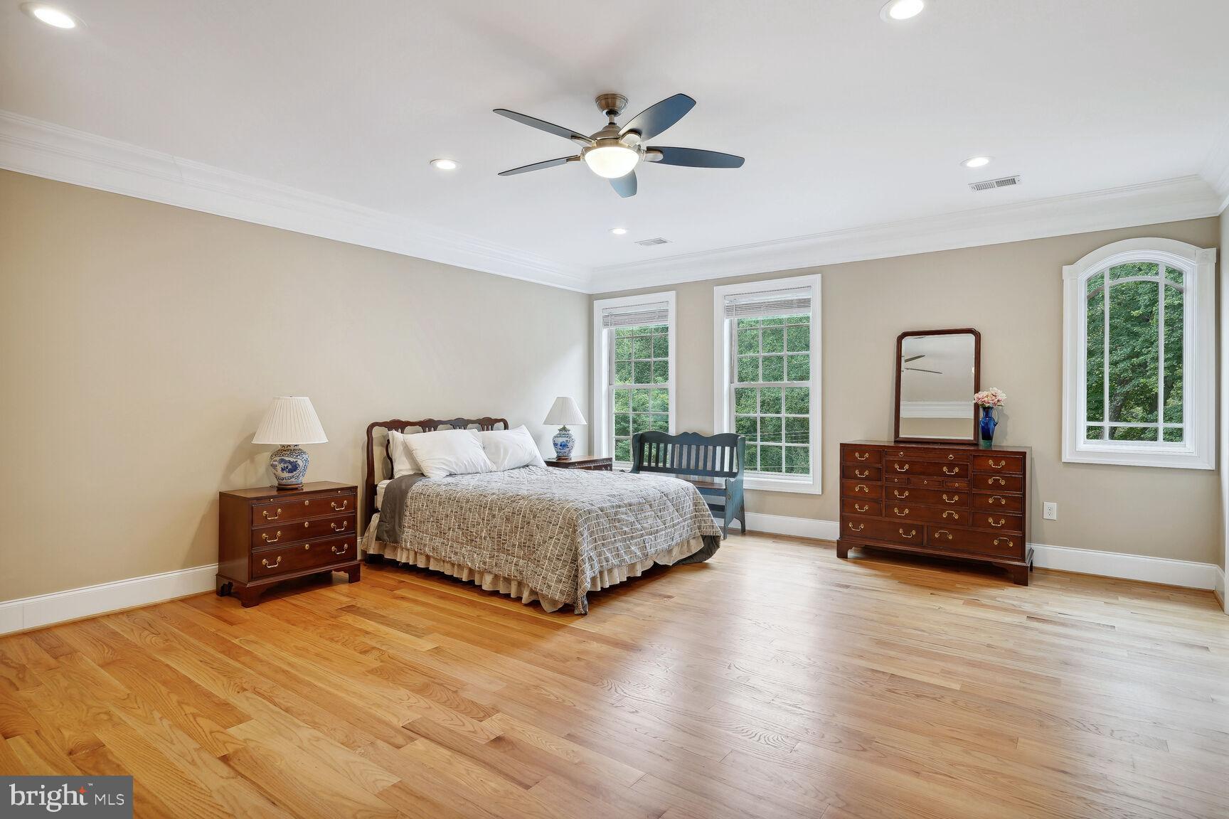 10813 Lockland Road Potomac, MD 20854 - Photo 45 of 73 a bedroom with a bed windows and dresser