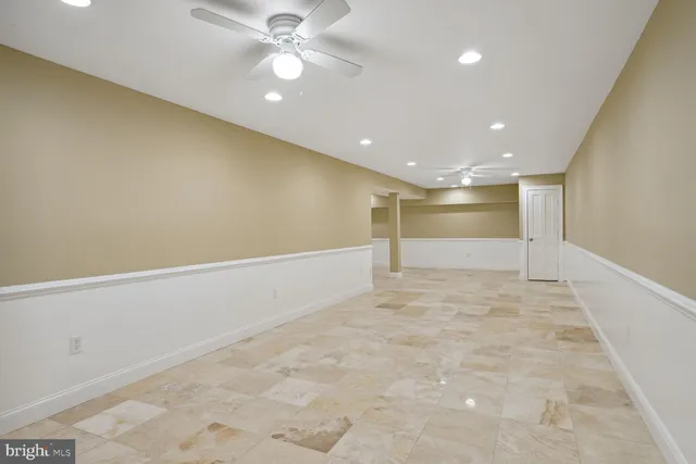 a view of a house with swimming pool and sitting area