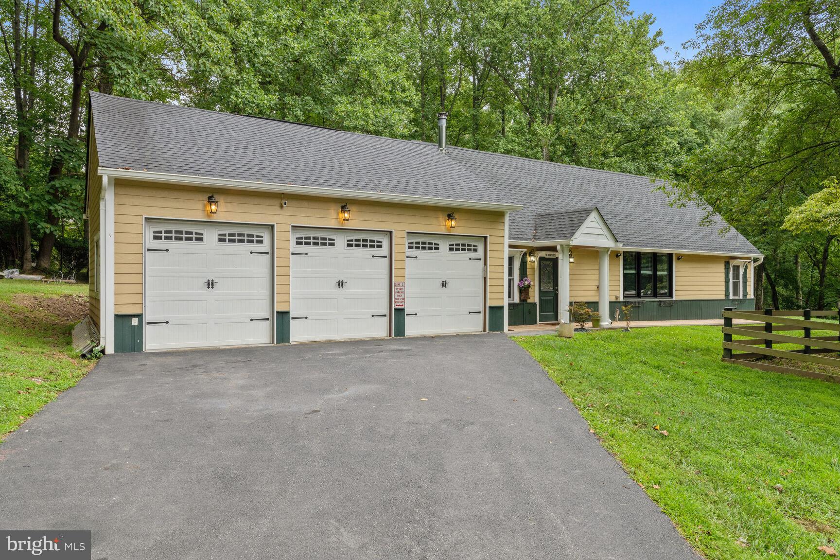 10813 Lockland Road Potomac, MD 20854 - Photo 55 of 73 a house view with a garden space