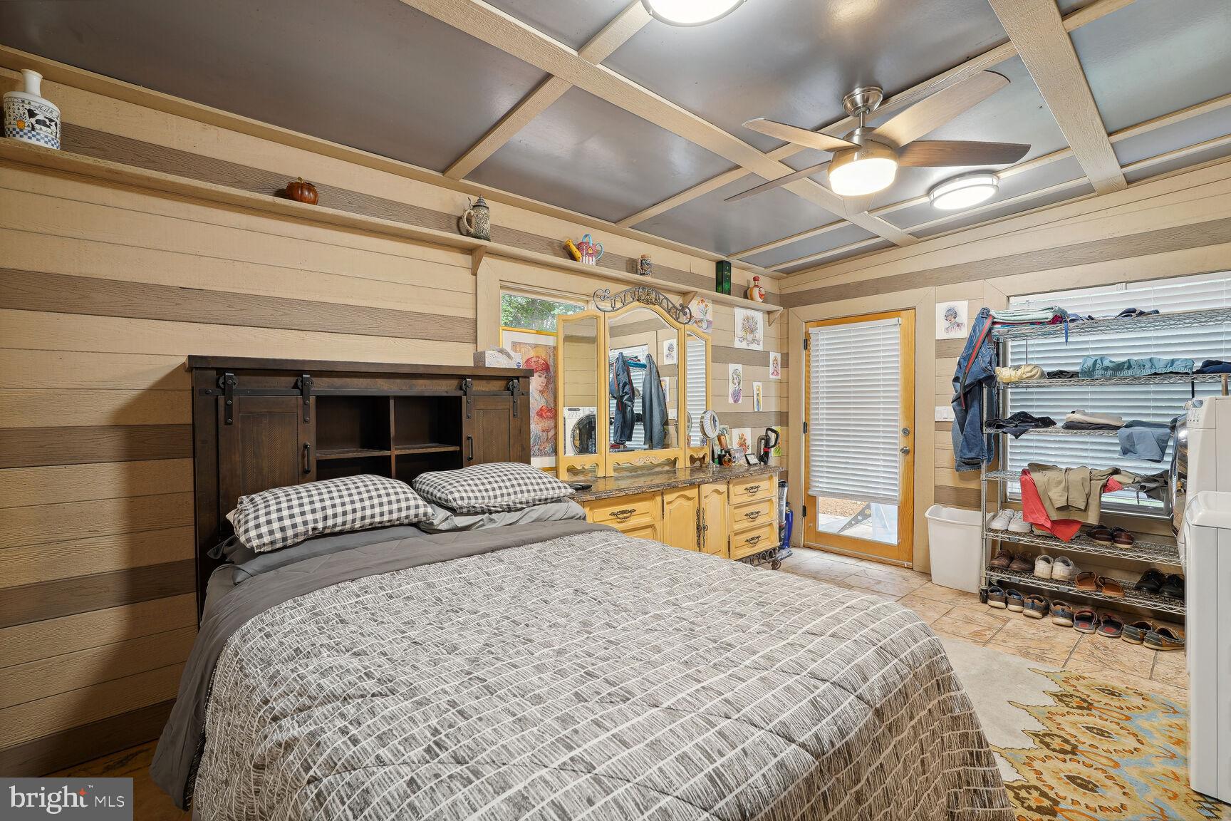 10813 Lockland Road Potomac, MD 20854 - Photo 60 of 73 a bedroom with a bed and dresser