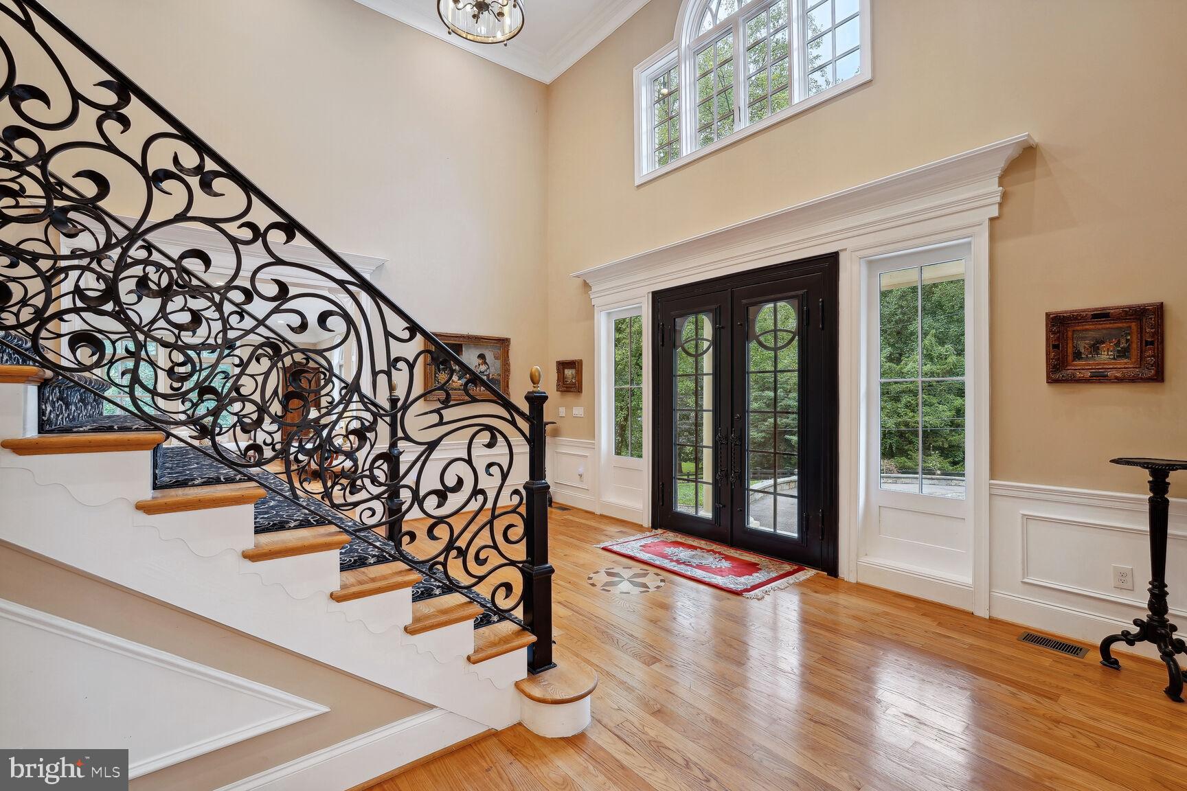 10813 Lockland Road Potomac, MD 20854 - Photo 9 of 73 a view of a entryway with stairs and a wooden floor