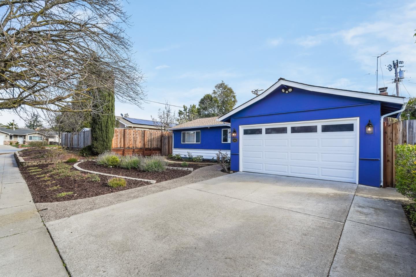 1684 Zinnia Lane San Jose, CA 95124 - Photo 2 of 33 a view of a house with a yard and garage