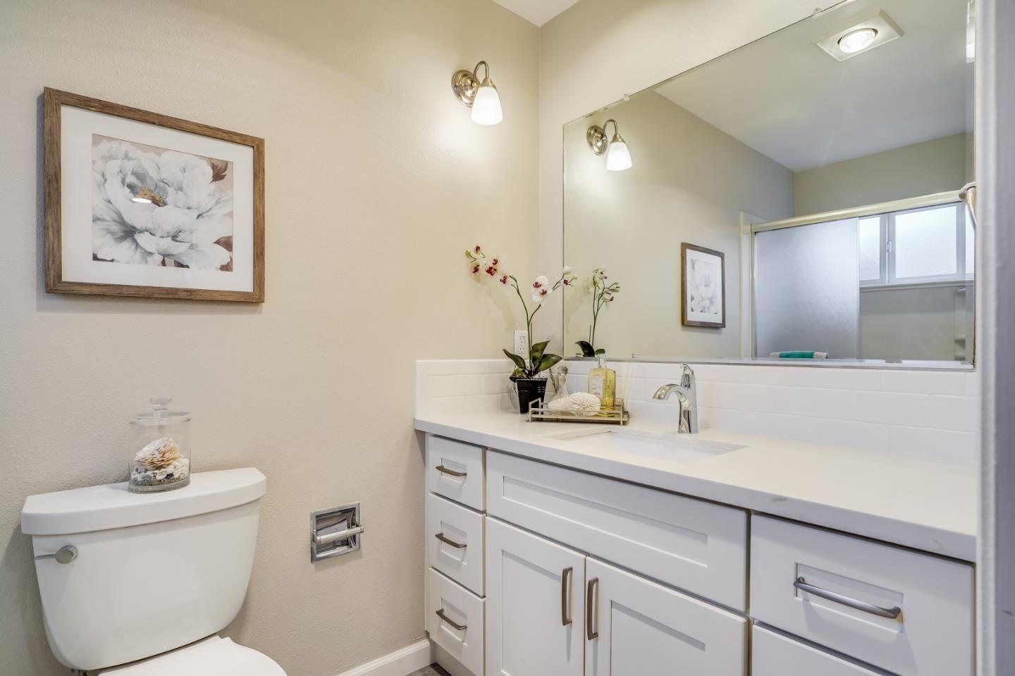 1684 Zinnia Lane San Jose, CA 95124 - Photo 24 of 33 a bathroom with a toilet sink and mirror