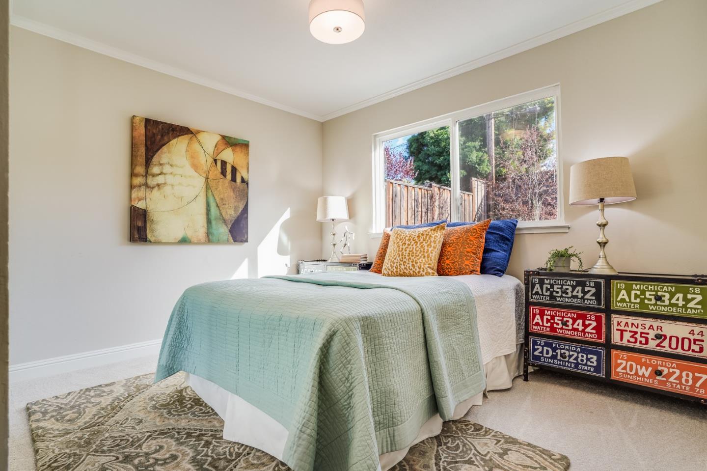 1684 Zinnia Lane San Jose, CA 95124 - Photo 26 of 33 a bedroom with a bed and a painting on the wall