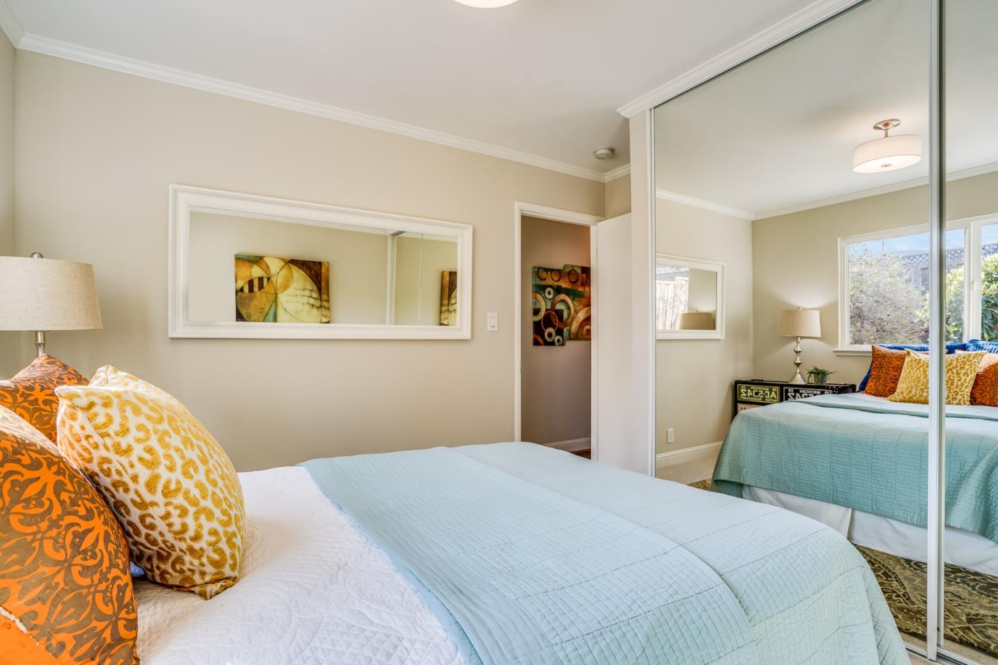 1684 Zinnia Lane San Jose, CA 95124 - Photo 27 of 33 a bedroom with a large bed and a chandelier