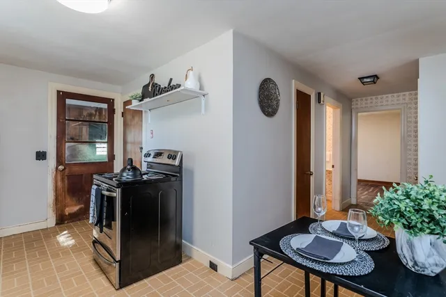 a kitchen with stainless steel appliances granite countertop a refrigerator and a stove