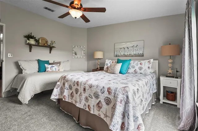 an aerial view of a house with outdoor space and a garden