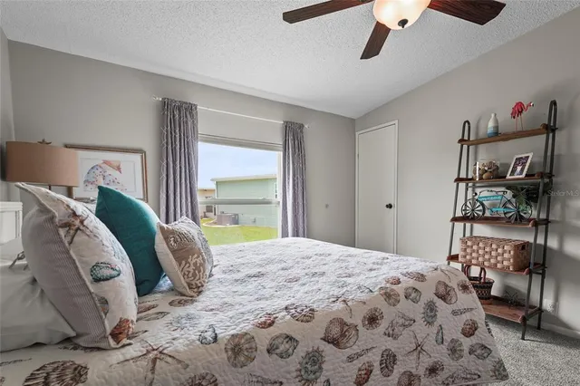 an aerial view of a house with a lake view