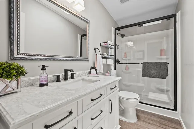 an aerial view of lake and residential houses with outdoor space