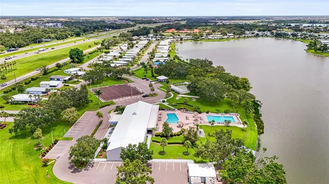 a view of a swimming pool with seating space