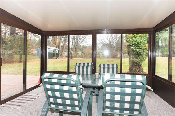 11 Doris Road Framingham, MA 01701 - Photo 15 of 21 a view of a large dining room with floor to ceiling window and an outdoor view