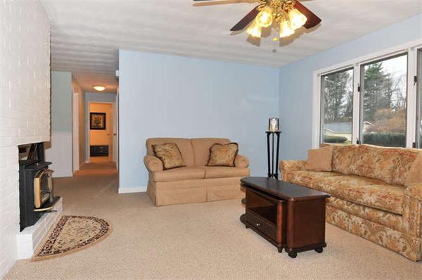 11 Doris Road Framingham, MA 01701 - Photo 3 of 21 a living room with furniture and a flat screen tv