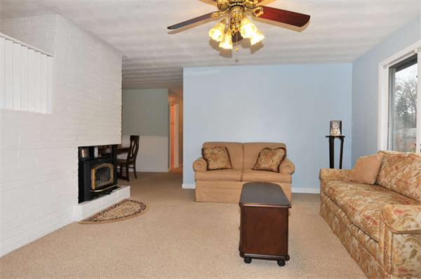 11 Doris Road Framingham, MA 01701 - Photo 5 of 21 a living room with furniture and a flat screen tv