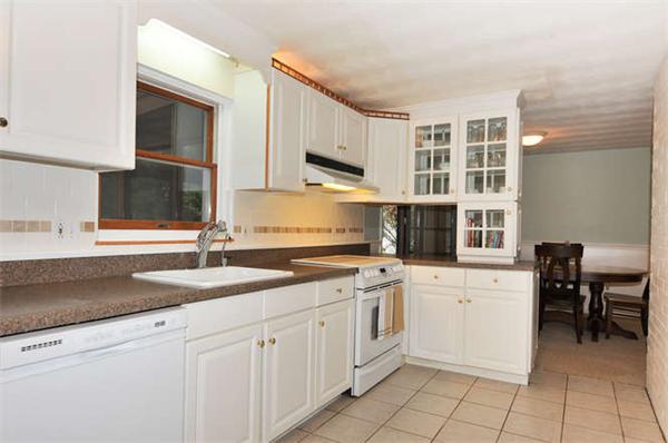 11 Doris Road Framingham, MA 01701 - Photo 7 of 21 a kitchen with stainless steel appliances granite countertop a sink and cabinets
