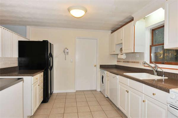 11 Doris Road Framingham, MA 01701 - Photo 8 of 21 a kitchen with granite countertop a sink and a stove top oven
