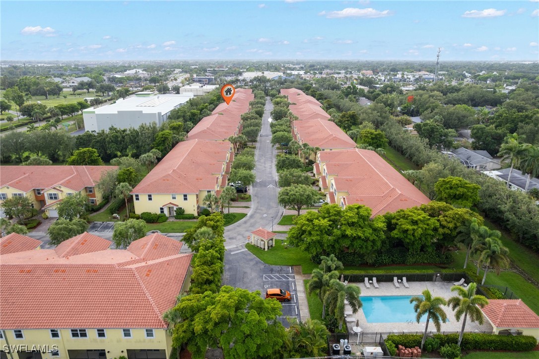 4381 Lazio Way, Unit 504 Fort Myers, FL 33901 - Photo 18 of 21 an aerial view of house with yard and ocean view