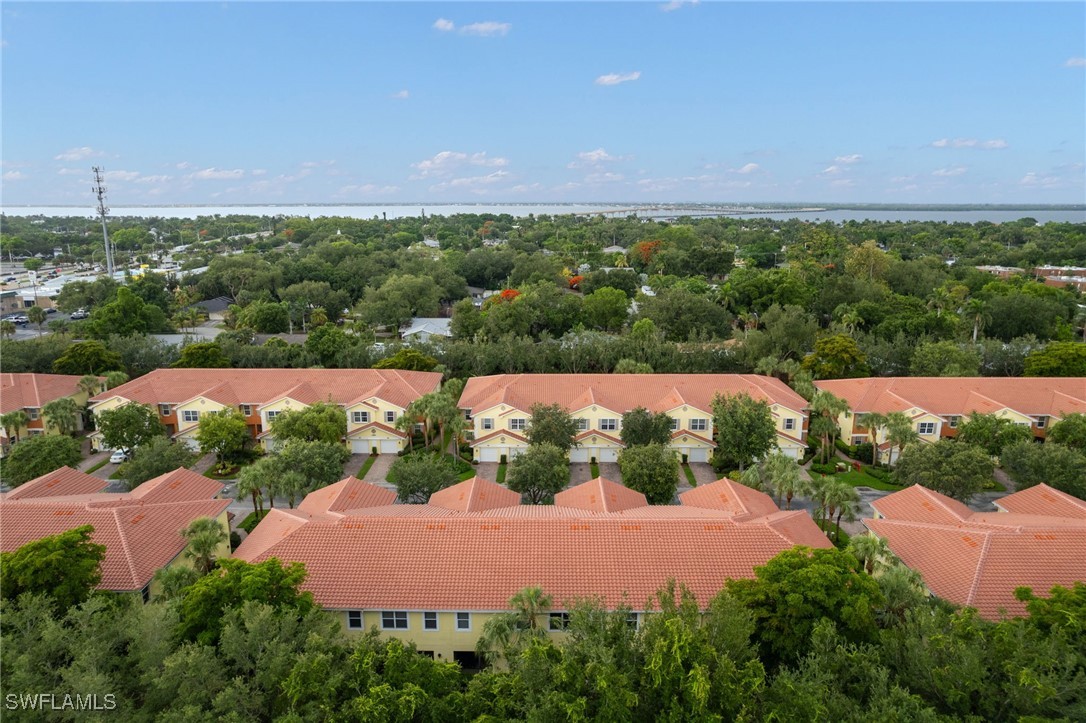 4381 Lazio Way, Unit 504 Fort Myers, FL 33901 - Photo 20 of 21 an aerial view of lake and green space