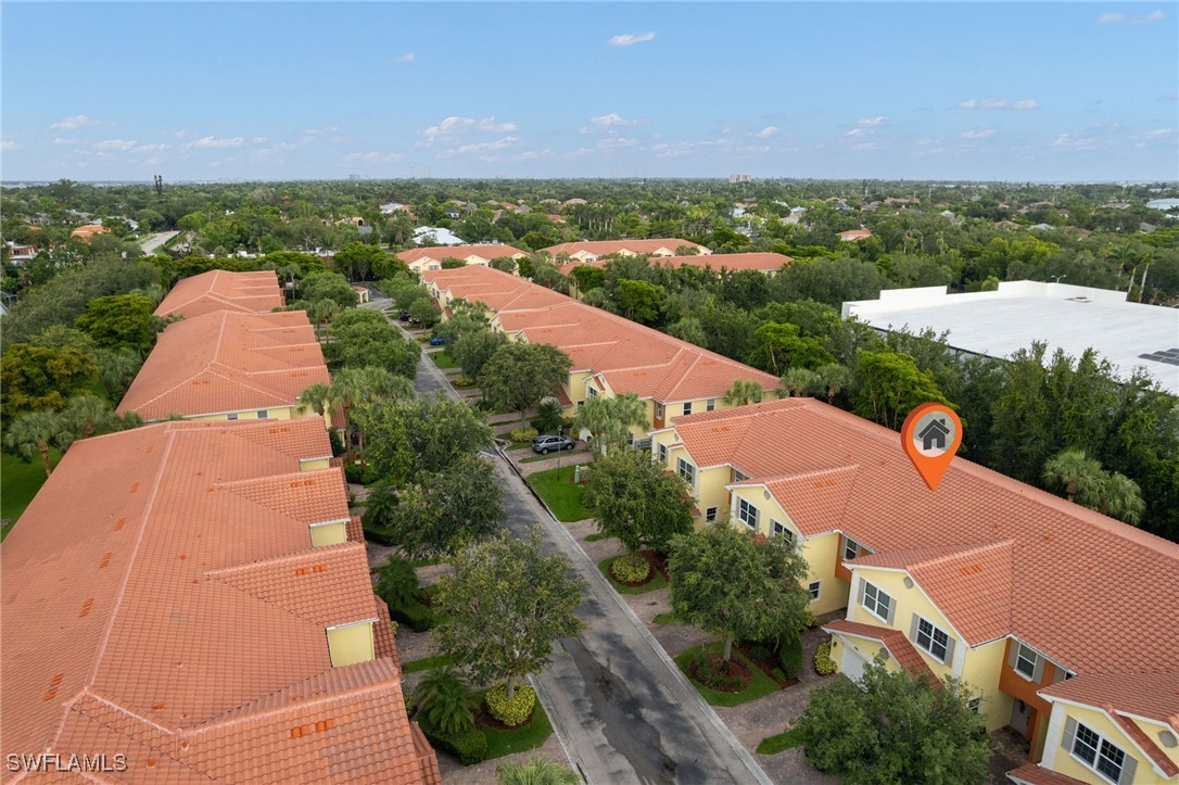 4381 Lazio Way, Unit 504 Fort Myers, FL 33901 - Photo 21 of 21 an aerial view of a house with yard