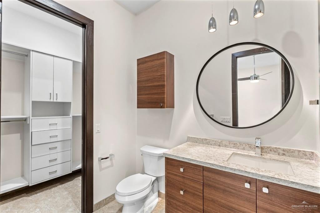 1425 Encanto Road, Unit SERVICE Weslaco, TX 78596 - Photo 26 of 45 Bathroom featuring vanity and a closet