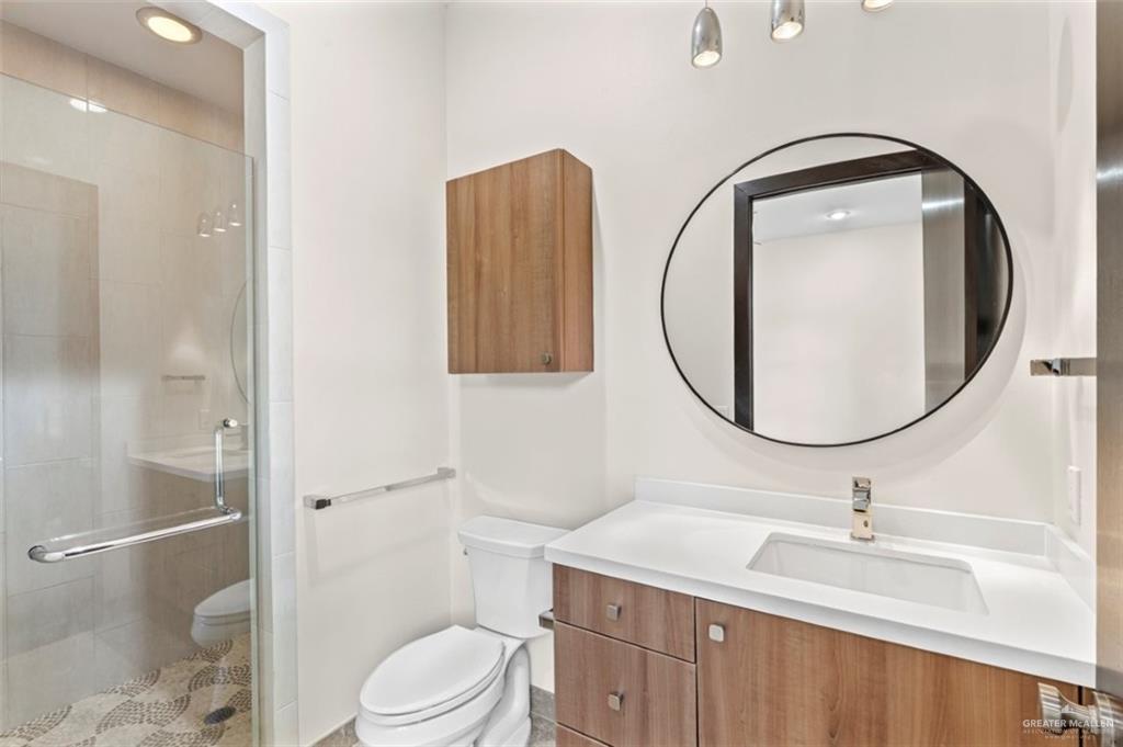 1425 Encanto Road, Unit SERVICE Weslaco, TX 78596 - Photo 29 of 45 Bathroom featuring a shower stall, vanity, and recessed lighting
