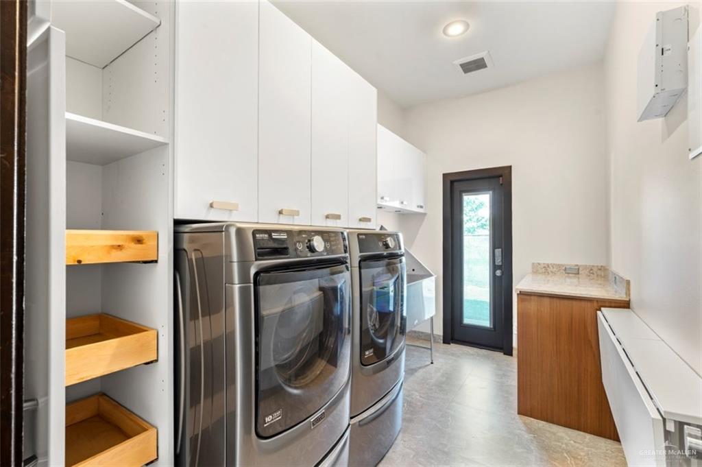1425 Encanto Road, Unit SERVICE Weslaco, TX 78596 - Photo 36 of 45 Laundry area with cabinet space and independent washer and dryer