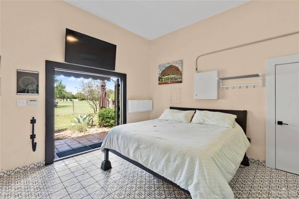 1425 Encanto Road, Unit SERVICE Weslaco, TX 78596 - Photo 40 of 45 Bedroom featuring access to outside