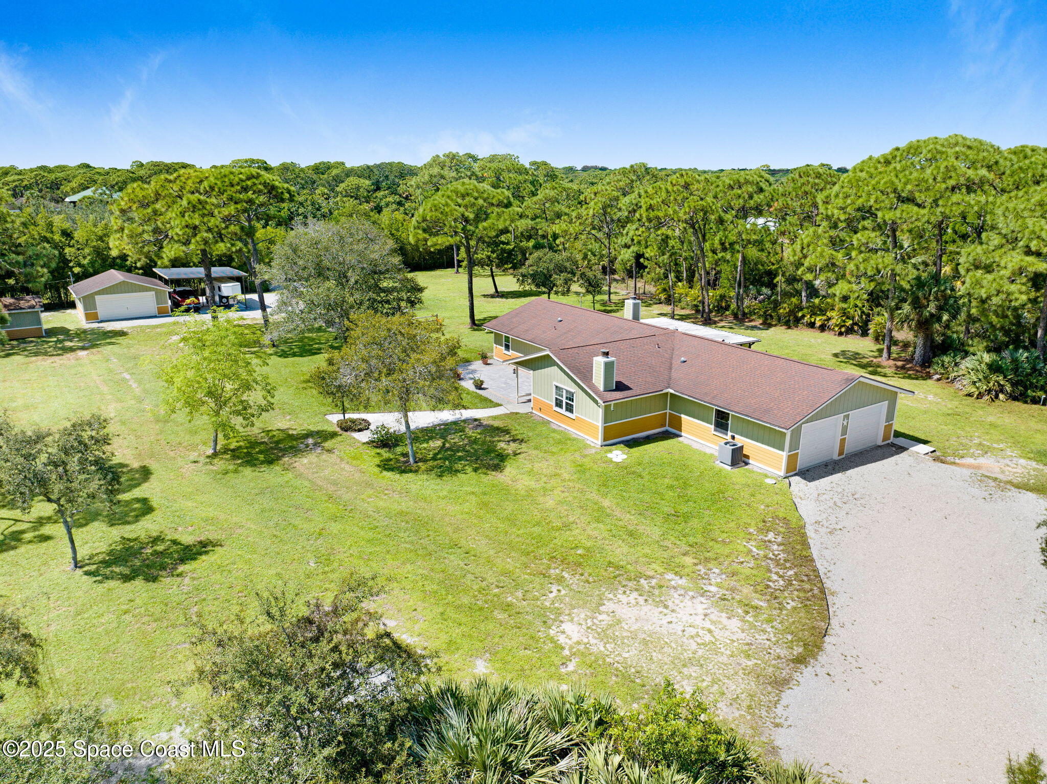 6570 Whispering Pines Lane Grant, FL 32949 - Photo 13 of 62 a view of a swimming pool with a garden