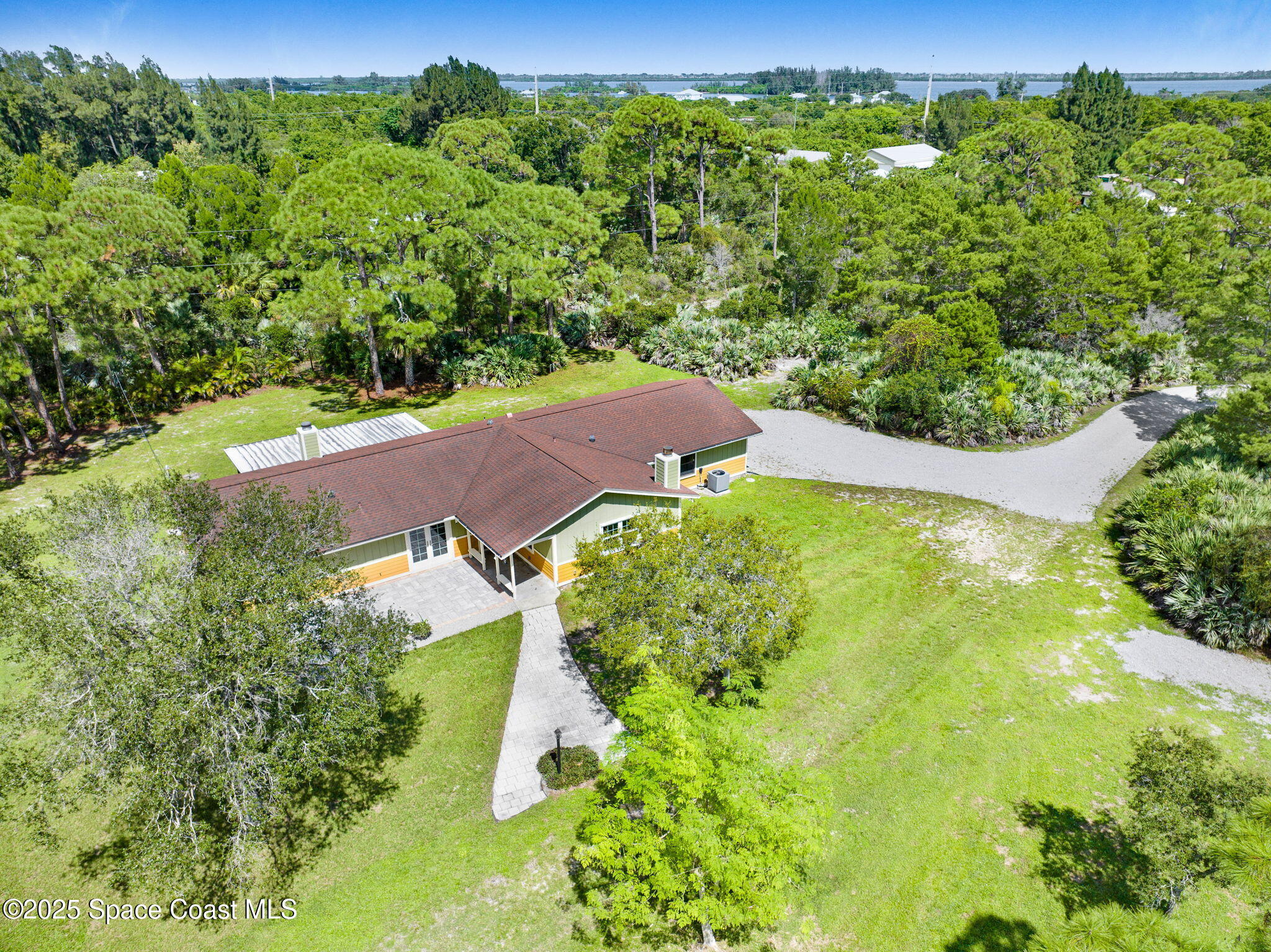 6570 Whispering Pines Lane Grant, FL 32949 - Photo 16 of 62 an aerial view of a house with yard