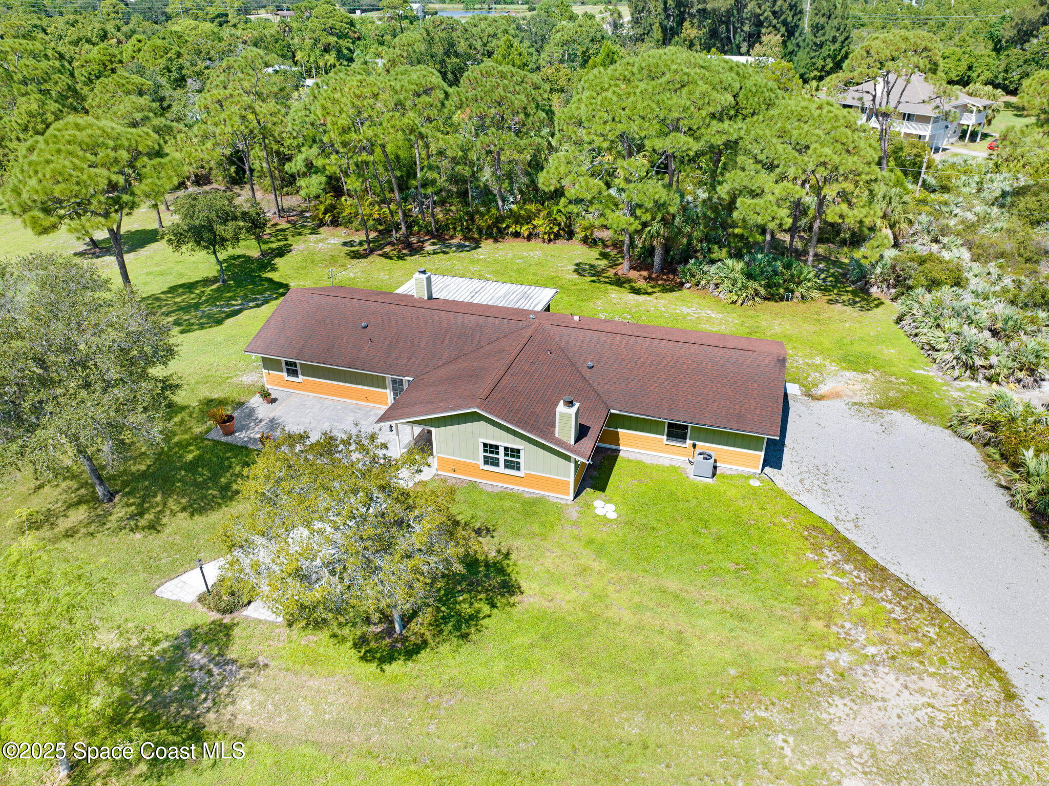 6570 Whispering Pines Lane Grant, FL 32949 - Photo 17 of 62 an aerial view of a house with yard swimming pool and outdoor seating